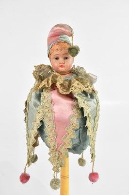 Lot 1410 - A French 1940s musical marotte doll, length 35cm.