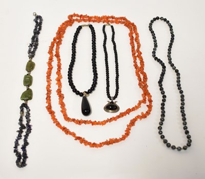 Lot 1023 - Twenty assorted hardstone and other necklaces...
