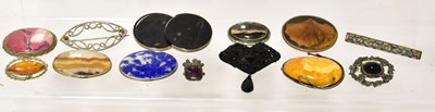 Lot 1004 - Twelve vintage brooches of various designs,...