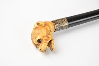 Lot 239 - A late 19th century walking cane, with carved...