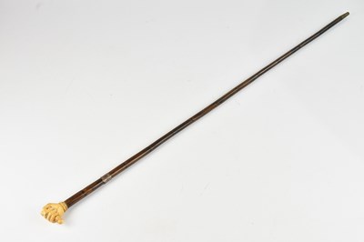 Lot 247 - An early 20th century walking cane with ivory...