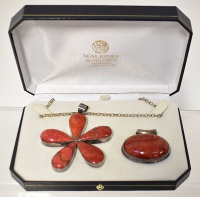 Lot 969 - A silver coral-set pendant in the form of a...