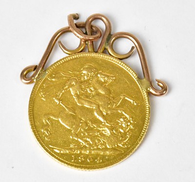 Lot 914 - An Edward VII sovereign, 1904, in a yellow...