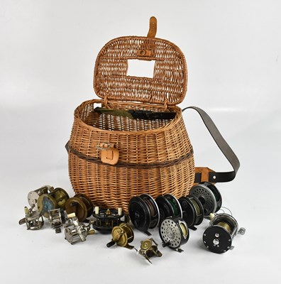 Lot 1417 - A vintage wicker fishing creel containing a...