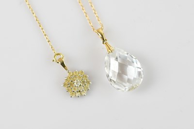 Lot 376 - A yellow metal mounted glass pendant stamped...
