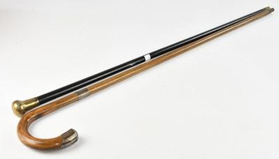Lot 319 - An ebonised walking cane with hallmarked...