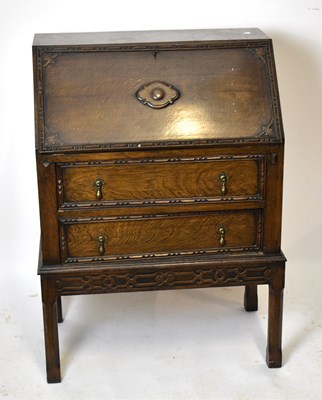 Lot 1700 - An early 20th century oak bureau