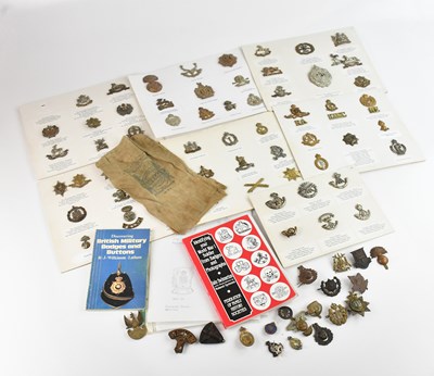 Lot 537 - A collection of British military cap badges...