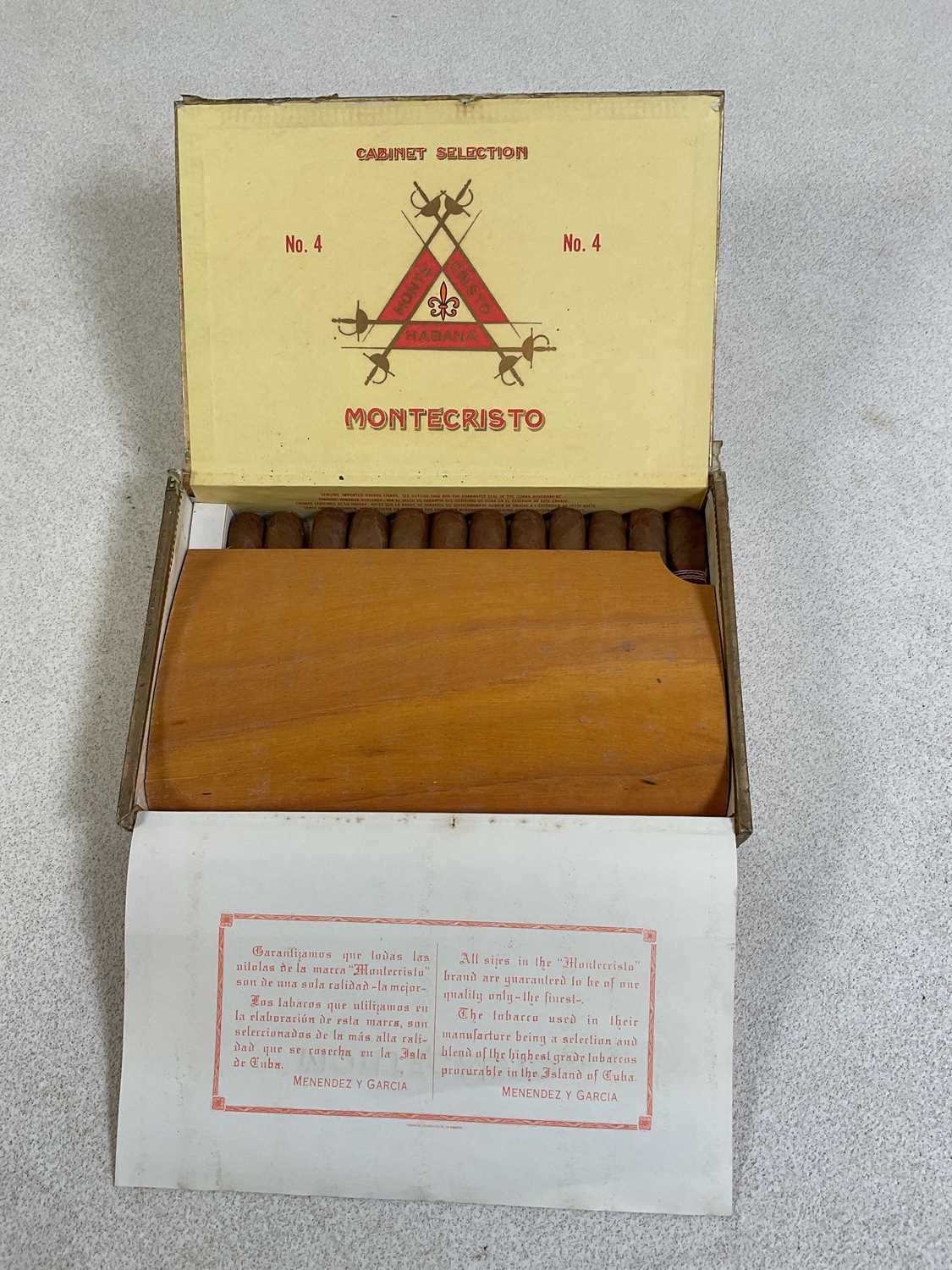 Lot 25 - MONTE CRISTO CIGARS; an opened box containing...