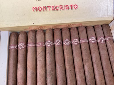 Lot 25 - MONTE CRISTO CIGARS; an opened box containing...