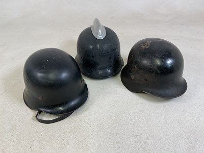 Lot 48 - Three German WWII helmets.