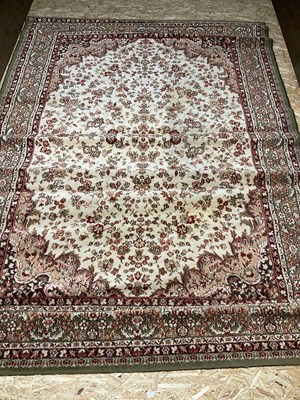 Lot 231 - A Persian floral pattern rug with pale...