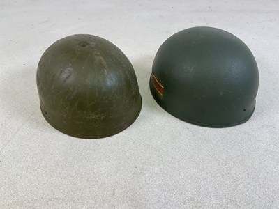 Lot 40 - Two British WWII era helmets, one a...