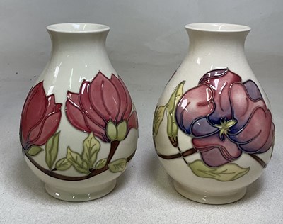 Lot 97 - MOORCROFT; a pair of 'Hibiscus' pattern vases,...