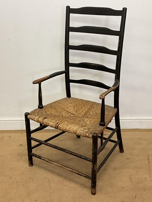 Lot 258 - A 19th century Arts and Crafts ladderback rush...