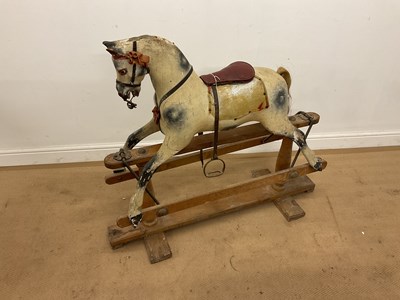 Lot 54 - A vintage wooden rocking horse. Height 95cm,...
