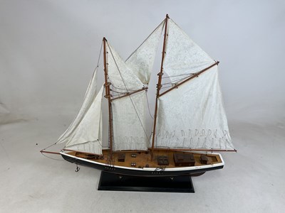 Lot 28 - A large model of yacht mounted on a base,...