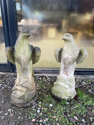Lot 234 - A pair of eagle stone effect statues, height...