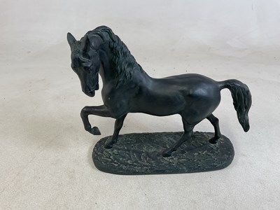Lot 23 - A resin statue of a horse, 38 x 42cm.