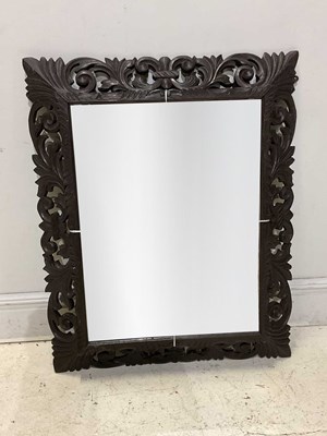 Lot 16 - A hand carved oak framed rectangular wall...