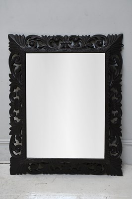 Lot 1143 - A hand carved oak framed rectangular wall...
