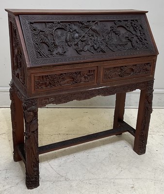 Lot 1436 - A Chinese camphorwood carved bureau, with a...