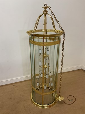 Lot 222 - A large contemporary brass and clear glass...