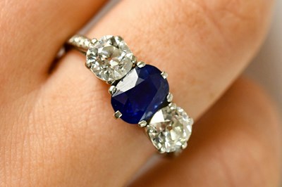 Lot 443 - A fine diamond and sapphire three stone ring,...