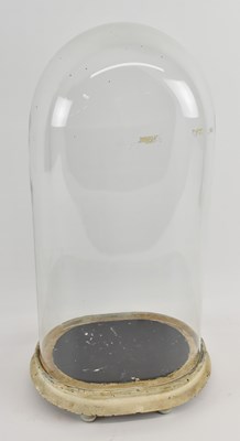 Lot 291 - A Victorian hand blown glass dome, raised on...