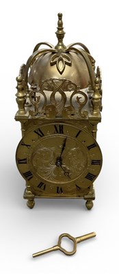 Lot 115 - An early 20th century brass cased bell dome...