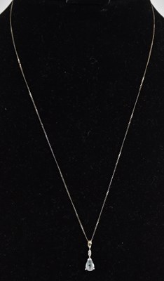 Lot 1350 - A 9ct white gold aquamarine and diamond set...