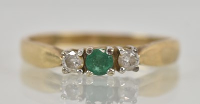 Lot 1252 - A 9ct yellow gold emerald and diamond set...