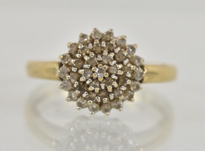 Lot 1253 - A 9ct yellow gold white stone set cluster ring,...