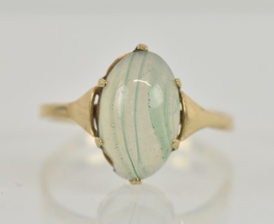 Lot 1285 - A 9ct yellow gold hardstone set ring, the...