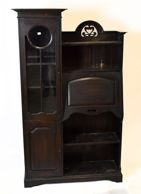 Lot 1690 - An Arts & Crafts oak bureau cabinet