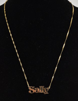Lot 1352 - A 9ct yellow gold fine dainty link identity...