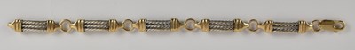 Lot 1405 - A 9ct yellow and white gold bracelet, with...