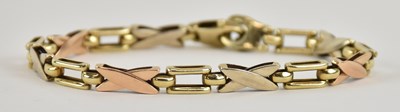 Lot 1407 - A 9ct tricolour gold bracelet, with white and...