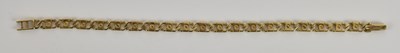 Lot 1408 - A 9ct yellow gold bracelet, with screw head...