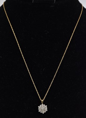 Lot 1354 - A 9ct yellow gold white stone set cluster...