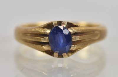Lot 1224 - An 18ct yellow gold blue topaz set signet ring,...