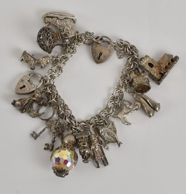Lot 1440 - A 925 silver charm bracelet, with charms...