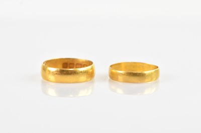 Lot 334 - Two 22ct gold wedding bands, size M and O,...