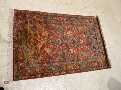 Lot 185 - A decorative Moroccan rug, decorated with...