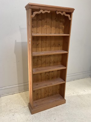 Lot 104 - A pine bookcase with four fixed shelves,...