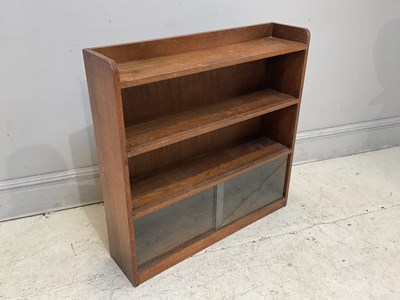 Lot 151 - An early 20th century bookcase, with two glass...
