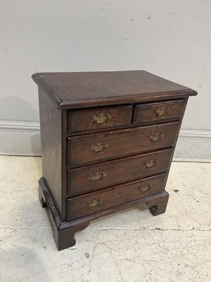 Lot 103 - A 19th century oak chest of five drawers,...