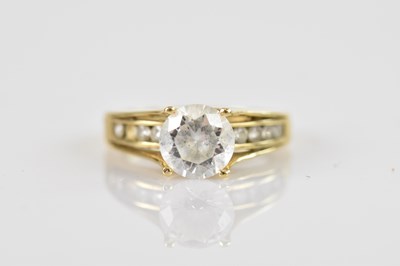 Lot 692 - A yellow metal dress ring set with a central...