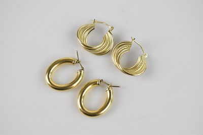 Lot 260 - A pair of yellow metal hoop earrings, test as...