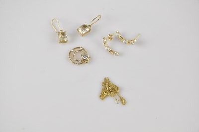 Lot 28 - A pair of yellow metal ear studs set with...